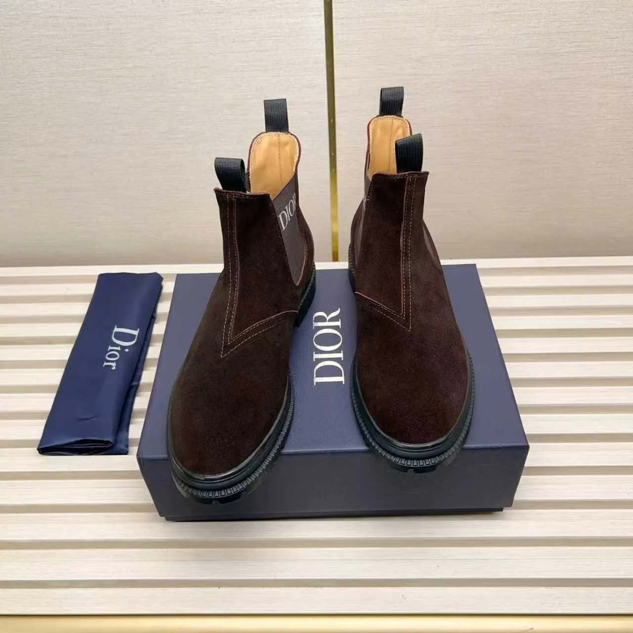 Men's Shoes 💰480 Dior A practical choice that combines protection with classic style. Made from durable Rugged Calf leather, it's tumbled and hand-finished to create a soft suede feel with a rich texture. Elastic side panels and subtle cutouts are inspired by the classic Chelsea boot. Leather upper and lining with Kummel tabs at front and rear, rubber outsole
